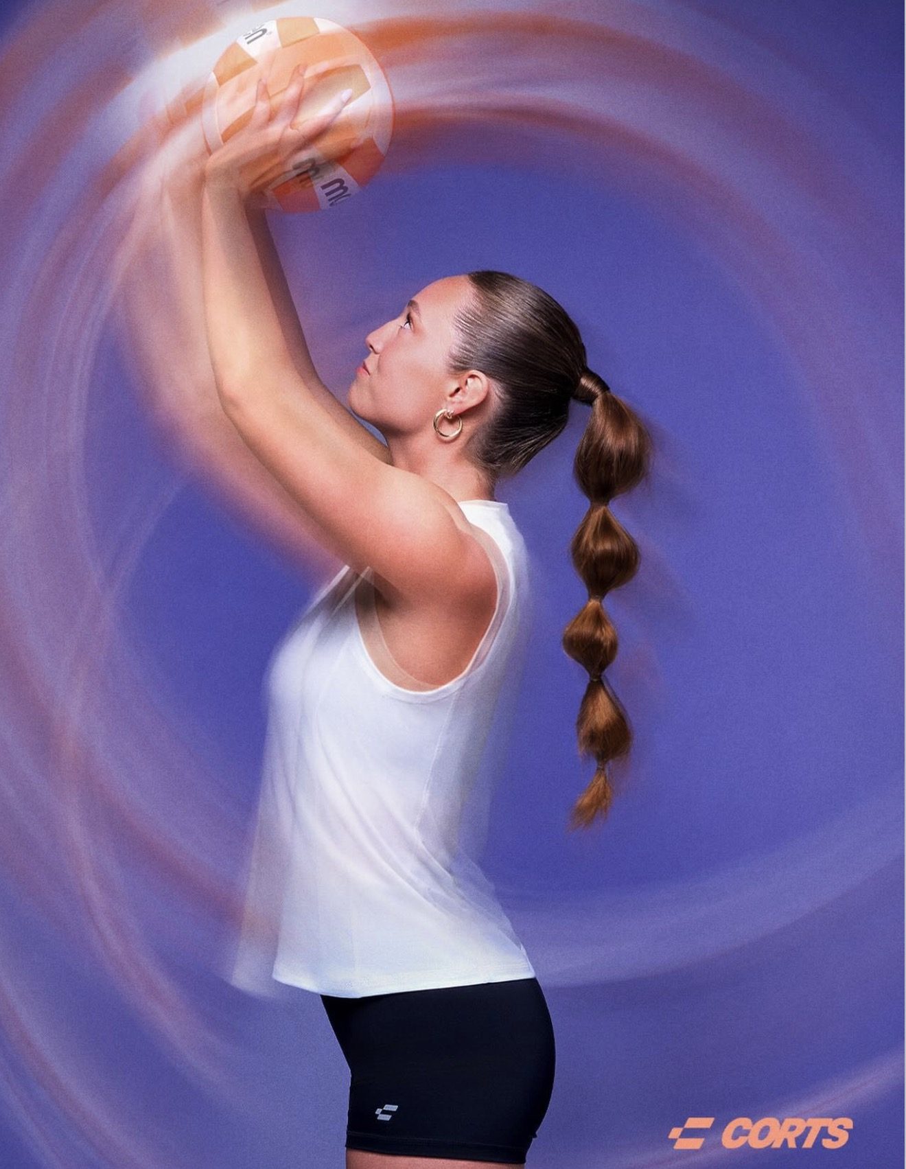 CORTS athlete setting a volleyball